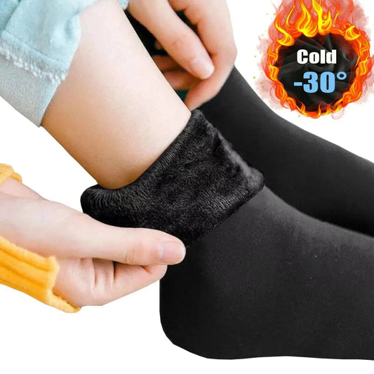 The image features a pair of warm socks in a cozy setting. The socks are designed for extreme cold, capable of withstanding temperatures as low as -30 degrees. The main color of the socks is highlighted, with a special emphasis on a black variant. The visual showcases the texture and warmth of the socks, providing a tactile sense of comfort for the wearer during chilly weather.